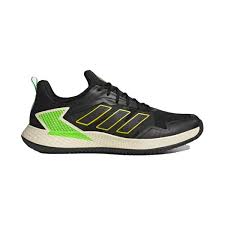 chaussure noire avec du vert fluo et une semelle blanche